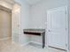 The office nook features a granite countertop, white trim and tile flooring at 11011 Little Blue Heron Dr, Riverview, FL 33579