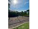 Covered playground with swings set on a wood chip play area at 11011 Little Blue Heron Dr, Riverview, FL 33579