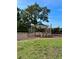 Colorful playground equipment on a wood chip area with seating nearby at 11011 Little Blue Heron Dr, Riverview, FL 33579