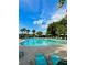 Resort-style community pool with lounge chairs and lush landscaping at 11011 Little Blue Heron Dr, Riverview, FL 33579