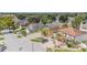 An aerial view of homes in a suburban neighborhood with many mature trees and landscaping and solar panels at 1205 Sweet Gum Dr, Brandon, FL 33511