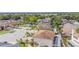 An aerial view of rooftops and mature trees in a suburban neighborhood with well-maintained lawns at 1205 Sweet Gum Dr, Brandon, FL 33511
