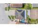 An aerial view showing solar panels on the roof and a backyard pool of a well-maintained home at 1205 Sweet Gum Dr, Brandon, FL 33511