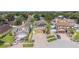 An aerial view of several homes in a lakeside community featuring well-kept lawns and mature trees at 1205 Sweet Gum Dr, Brandon, FL 33511