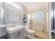 Bathroom featuring a glass-enclosed shower, a vanity with a sink, and decorative accents at 1205 Sweet Gum Dr, Brandon, FL 33511