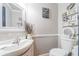 Chic powder room with modern fixtures, decorative mirror, and stylish decor creating a welcoming space at 1205 Sweet Gum Dr, Brandon, FL 33511