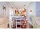 Cozy dining area with hardwood floors leading to the kitchen and outdoor patio at 1205 Sweet Gum Dr, Brandon, FL 33511