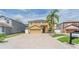 Charming two-story home with a well-manicured lawn and a spacious driveway, enhancing its curb appeal at 1205 Sweet Gum Dr, Brandon, FL 33511
