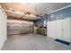 Spacious garage featuring ample storage, workbench, and epoxy floors at 1205 Sweet Gum Dr, Brandon, FL 33511