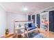 Hallway with neutral paint, stylish wainscoting, and bench seating with blue pillows and a matching blue area rug at 1205 Sweet Gum Dr, Brandon, FL 33511