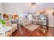 Open-concept living room showcases hardwood floors connecting to the kitchen and dining area at 1205 Sweet Gum Dr, Brandon, FL 33511