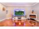 Entertainment center setup in living room with large television and modern fireplace at 1205 Sweet Gum Dr, Brandon, FL 33511