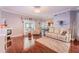 Bright living room with hardwood floors, comfortable seating, and natural light streaming in at 1205 Sweet Gum Dr, Brandon, FL 33511