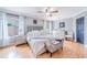 Bedroom featuring a king-sized bed, soft lighting, and elegant decor with plenty of natural light at 1205 Sweet Gum Dr, Brandon, FL 33511