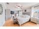 Main bedroom boasting fireplace, hardwood floors, an accent chair and dresser at 1205 Sweet Gum Dr, Brandon, FL 33511