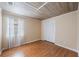 Bedroom featuring wood floors, a window, and a closet at 12405 Pathway Ct, Riverview, FL 33569