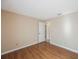 An empty bedroom featuring wood floors and a closet at 12405 Pathway Ct, Riverview, FL 33569