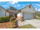 Attractive single-story home boasts a two-car garage, tidy landscaping, and a welcoming brick-accented entrance at 12405 Pathway Ct, Riverview, FL 33569