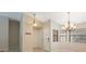 Inviting foyer featuring neutral tones, tiled floors, and decorative lighting fixtures at 12405 Pathway Ct, Riverview, FL 33569