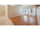 Bright and airy living room with wood floors and lots of natural light from windows and an open floor plan at 12405 Pathway Ct, Riverview, FL 33569