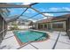 Screened pool with brick trim offers relaxation and privacy for enjoying outdoor living in a backyard oasis at 12405 Pathway Ct, Riverview, FL 33569