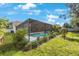 Secluded screened-in pool with tropical plants offers relaxation and privacy for enjoying outdoor living at 12405 Pathway Ct, Riverview, FL 33569