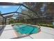 Enjoy outdoor living in this screened pool surrounded by lush landscaping in a backyard setting at 12405 Pathway Ct, Riverview, FL 33569