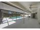 A covered patio area with a pool enclosed by a screen at 12405 Pathway Ct, Riverview, FL 33569