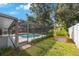 Screened pool surrounded by lush greenery providing a private retreat for relaxation and outdoor enjoyment at 12405 Pathway Ct, Riverview, FL 33569