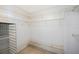 A walk-in closet with wire shelving and neutral walls at 12405 Pathway Ct, Riverview, FL 33569