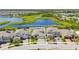 Aerial view of home featuring lush landscaping and a pristine lawn in a gated community at 12607 Pensacola Ct, Riverview, FL 33579
