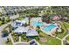 An aerial view featuring a community pool and amenity center at 12607 Pensacola Ct, Riverview, FL 33579