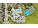 Overhead shot of community pool, tennis and basketball courts, clubhouse, and parking at 12607 Pensacola Ct, Riverview, FL 33579
