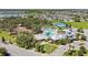 Community amenities featuring a swimming pool, clubhouse, tennis court, and plenty of green space at 12607 Pensacola Ct, Riverview, FL 33579