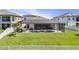 A spacious backyard with a screened-in pool area, offering privacy and outdoor enjoyment at 12607 Pensacola Ct, Riverview, FL 33579
