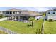 A lovely backyard with a screened in pool and green grass at 12607 Pensacola Ct, Riverview, FL 33579