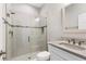 Clean, modern bathroom with a glass-enclosed shower, white vanity, and tile accents at 12607 Pensacola Ct, Riverview, FL 33579