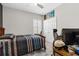 Cozy bedroom featuring a comfortable bed, ceiling fan, and ample closet space at 12607 Pensacola Ct, Riverview, FL 33579