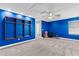 Large bonus room with bright blue accent wall, carpet flooring, recessed lighting, and ceiling fan at 12607 Pensacola Ct, Riverview, FL 33579