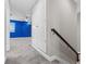 Spacious hallway with plush carpeting, large storage closet and views of a bright room through the window at 12607 Pensacola Ct, Riverview, FL 33579