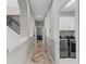 Hallway area with laundry room featuring modern washer and dryer at 12607 Pensacola Ct, Riverview, FL 33579