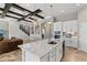 Bright kitchen with white cabinetry, stainless appliances, and beautiful floors at 12607 Pensacola Ct, Riverview, FL 33579