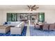 Open-concept living space with stylish furnishings and seamless transition to the outdoor patio at 12607 Pensacola Ct, Riverview, FL 33579