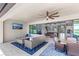 Back patio featuring outdoor living area with TV and dining space at 12607 Pensacola Ct, Riverview, FL 33579