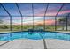 Breathtaking view from screened-in pool with serene water features at 12607 Pensacola Ct, Riverview, FL 33579