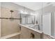 Shower with a glass enclosure and a mosaic tile accent and a view of the double sink vanity at 12607 Pensacola Ct, Riverview, FL 33579