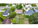 Aerial view of a well-placed single-Gathering home with mature trees and spacious back yard, within a serene neighborhood at 15820 Sapwood St, Tampa, FL 33624