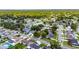 An aerial view reveals a charming single-Gathering home, complemented by mature trees, lawns, and a peaceful neighborhood vibe at 15820 Sapwood St, Tampa, FL 33624