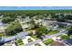 An aerial view features this beautiful single-Gathering home nestled in a tranquil neighborhood with tree-lined streets at 15820 Sapwood St, Tampa, FL 33624
