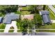 An aerial view highlights this single-Gathering home, a lawn, mature trees, and invites thoughts of peaceful neighborhood living at 15820 Sapwood St, Tampa, FL 33624